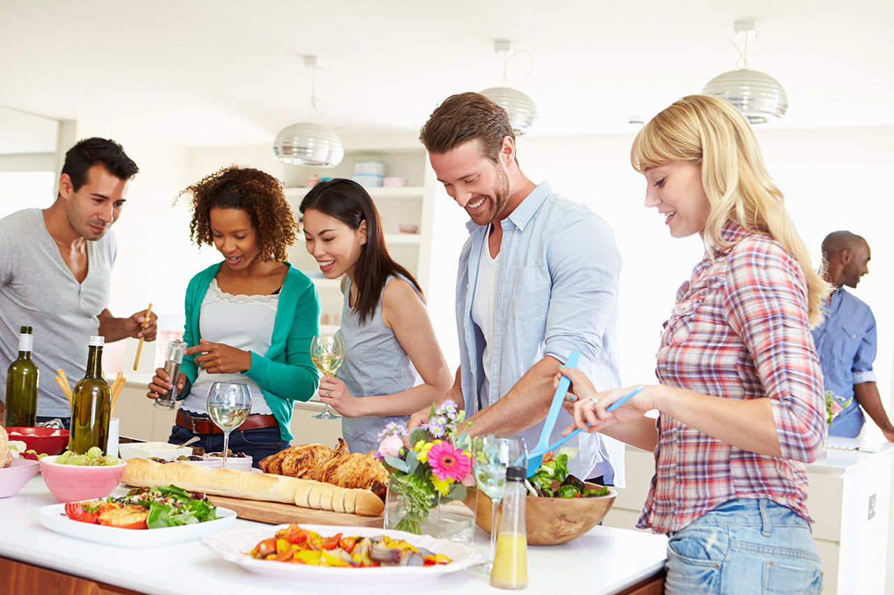Group Of Friends Having Dinner Party At Home